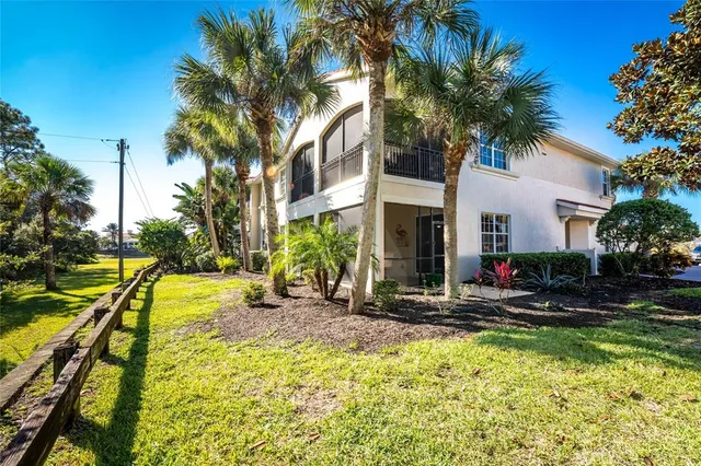 an entryway with a dining room and livingroom view