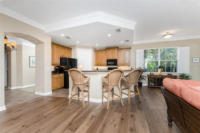 a bed room with furniture and a large window