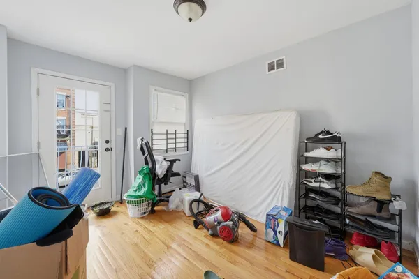 a bedroom with furniture and a book shelf