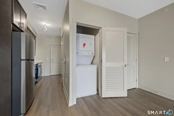 a view of hallway with wooden floor