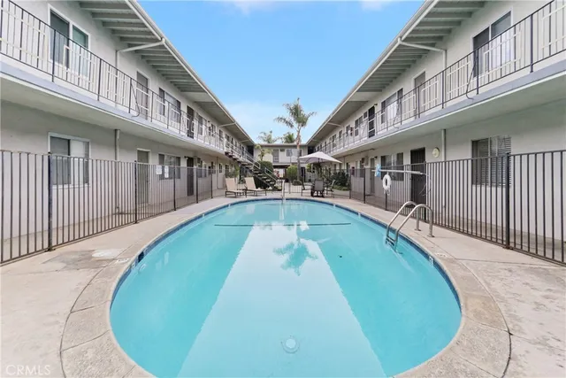 swimming pool view with a outdoor seating