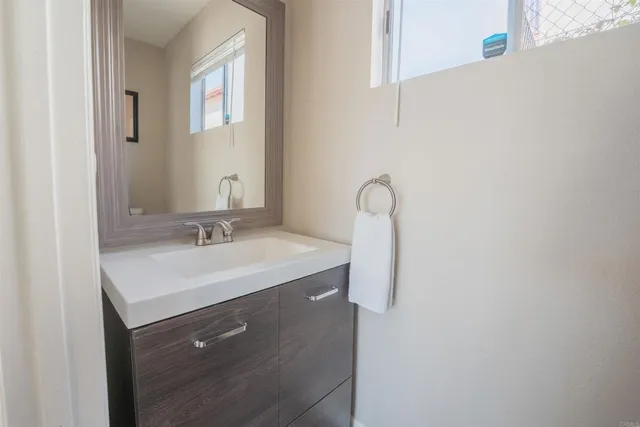 a bathroom with a sink and a mirror