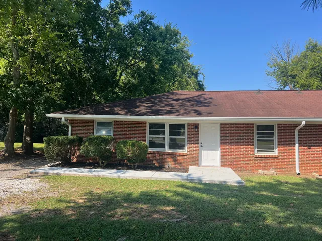 a house view with a garden space