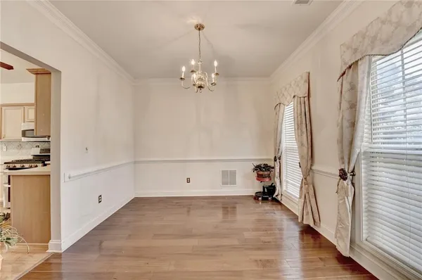 a view of a livingroom with a fireplace wooden floor and furniture