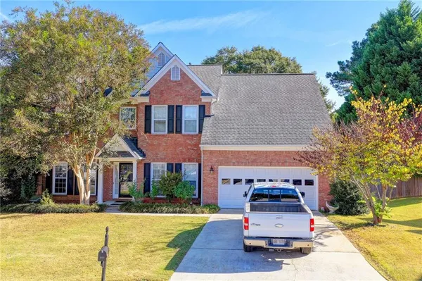 front view of a house with a yard