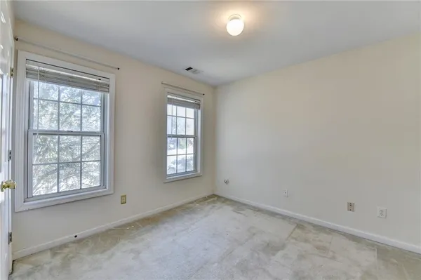 an empty room with windows