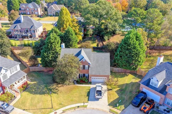 an aerial view of a swimming pool patio and outdoor seating