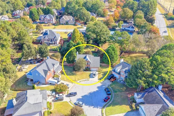 an aerial view of a house with swimming pool