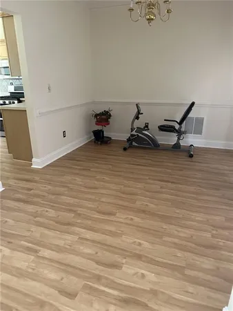 a kitchen with a sink a refrigerator and cabinets
