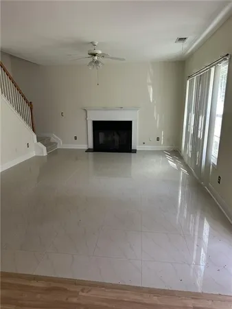 a kitchen with a sink cabinets and wooden floor