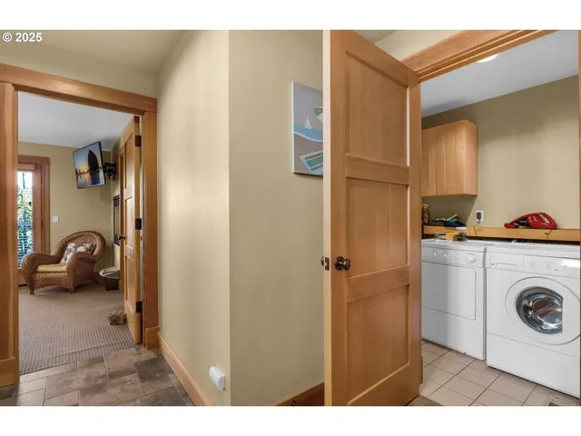 a view of a hallway to a livingroom and a couch