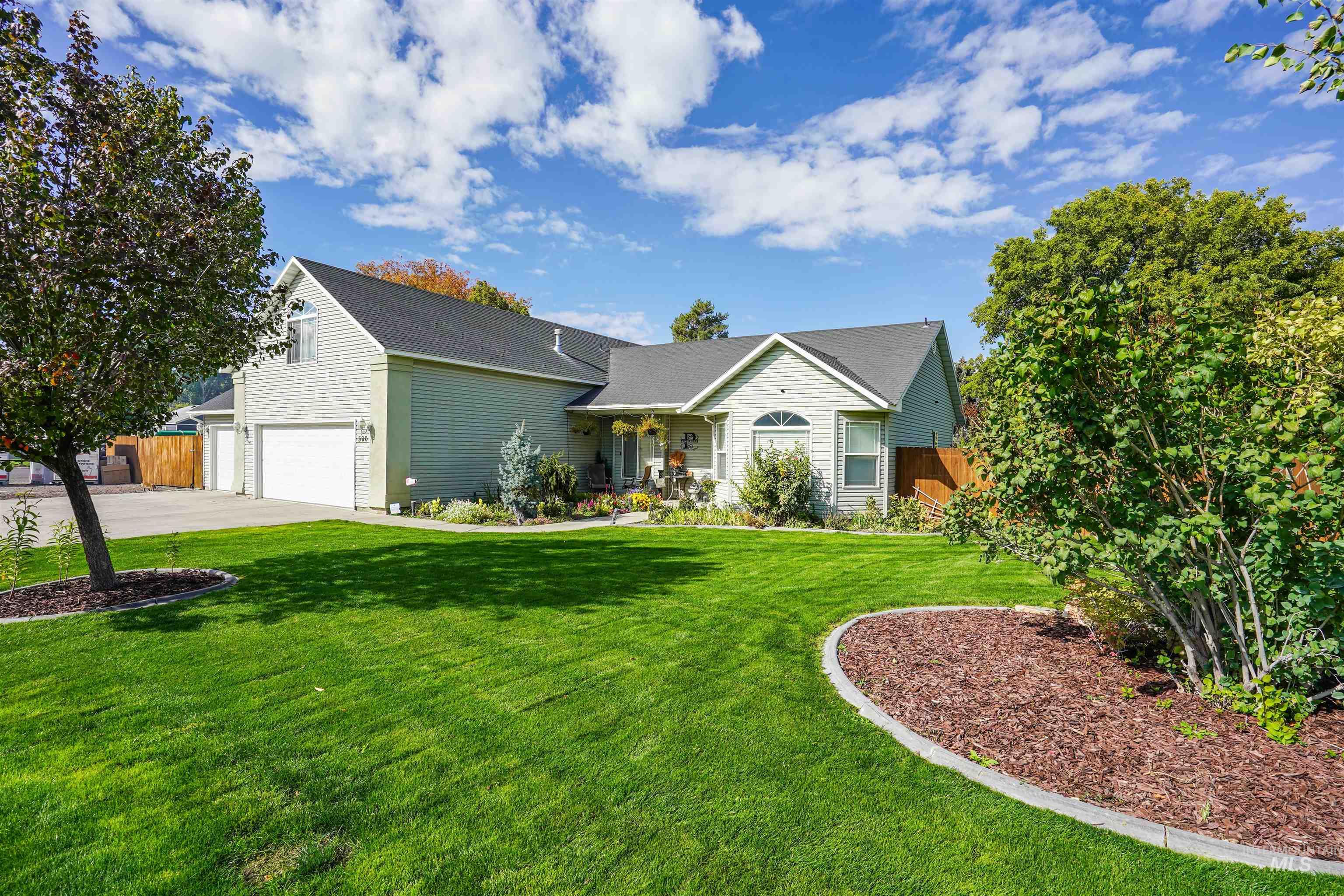 500 East 19th Street Burley, ID 83318 - Photo 1 of 31 View of front of house with an attached garage, driveway, and covered porch