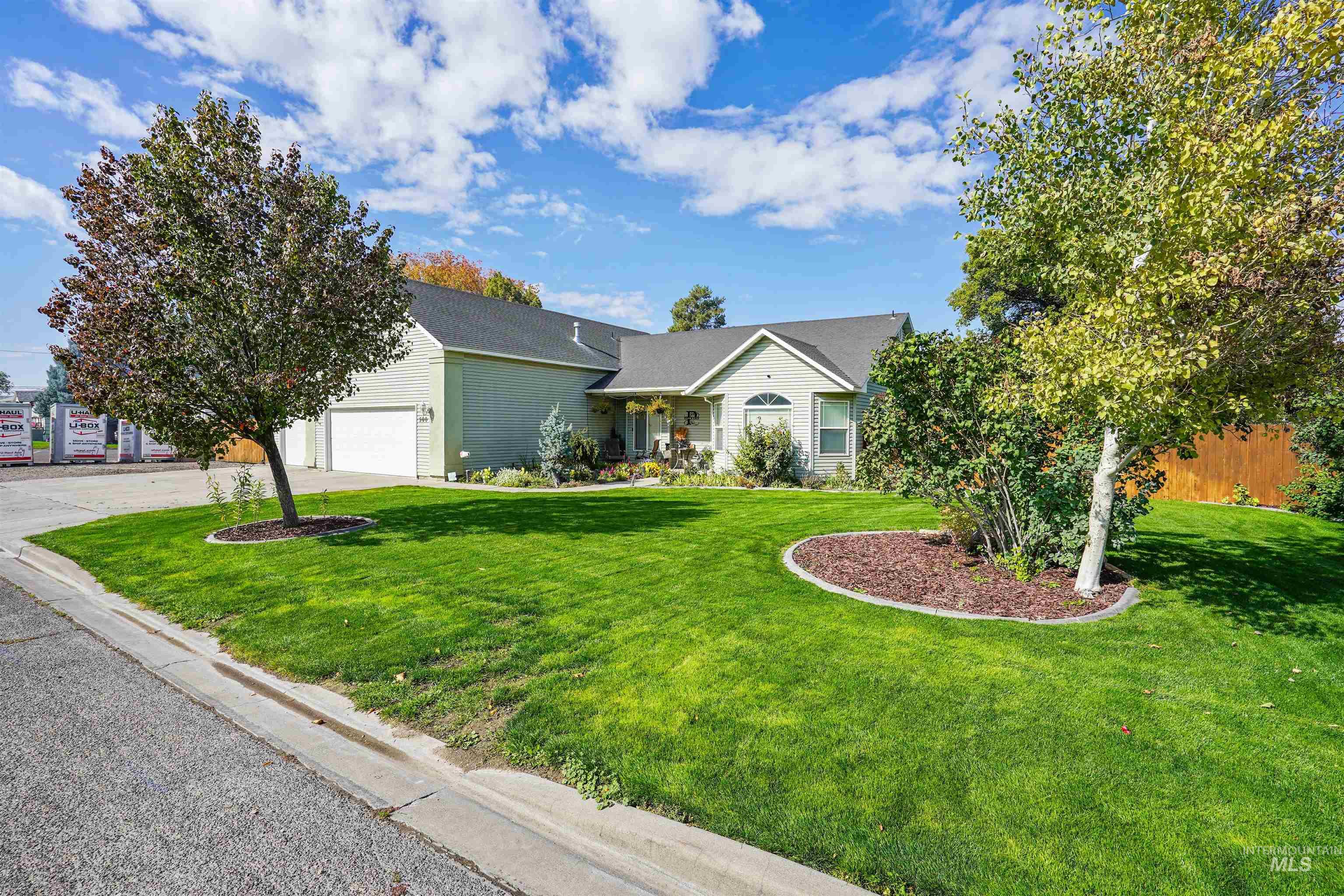 500 East 19th Street Burley, ID 83318 - Photo 23 of 31 View of front of home with a front lawn, concrete driveway, and an attached garage