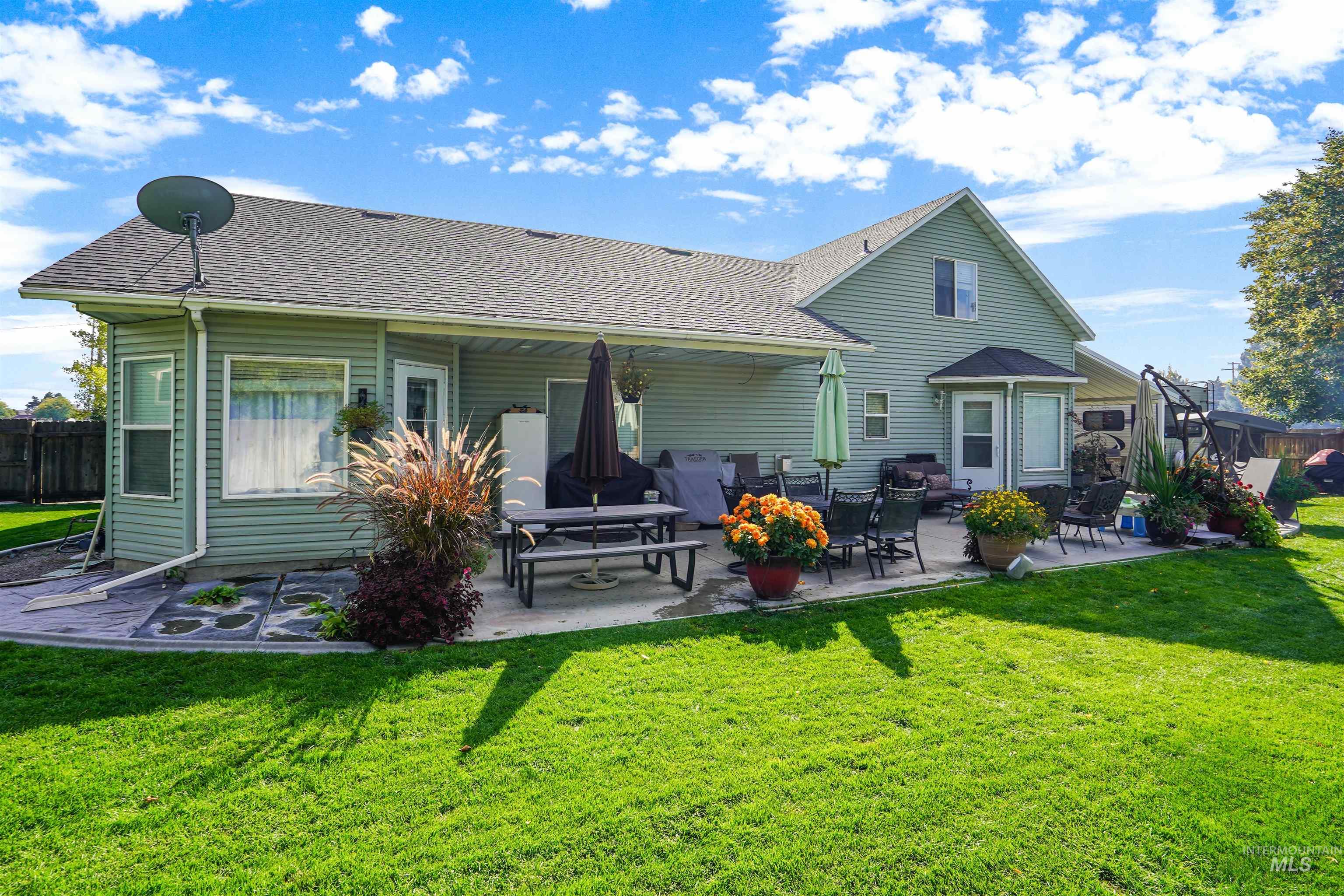 500 East 19th Street Burley, ID 83318 - Photo 25 of 31 Rear view of house featuring a patio and a shingled roof