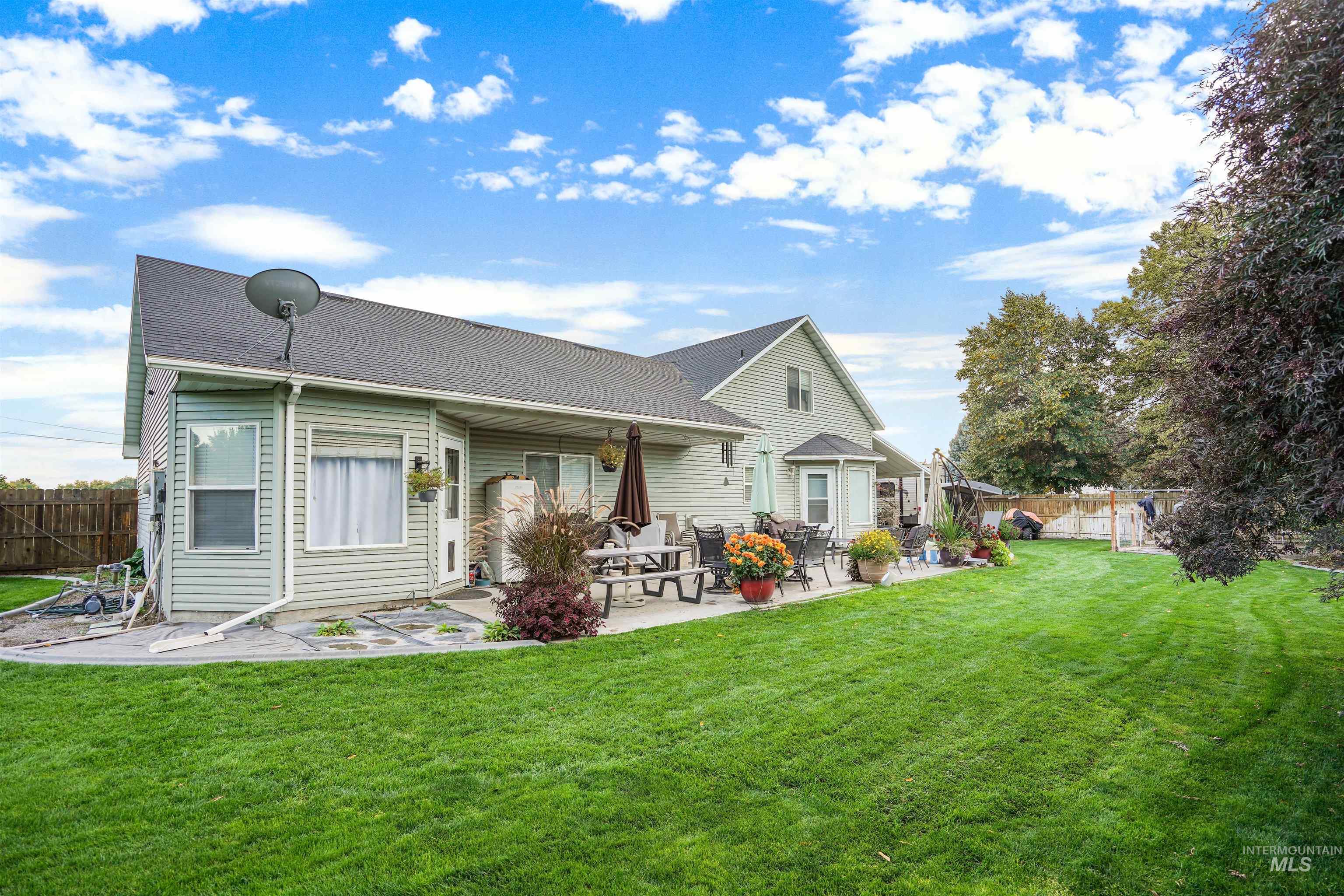 500 East 19th Street Burley, ID 83318 - Photo 27 of 31 Rear view of house featuring a patio area and roof with shingles
