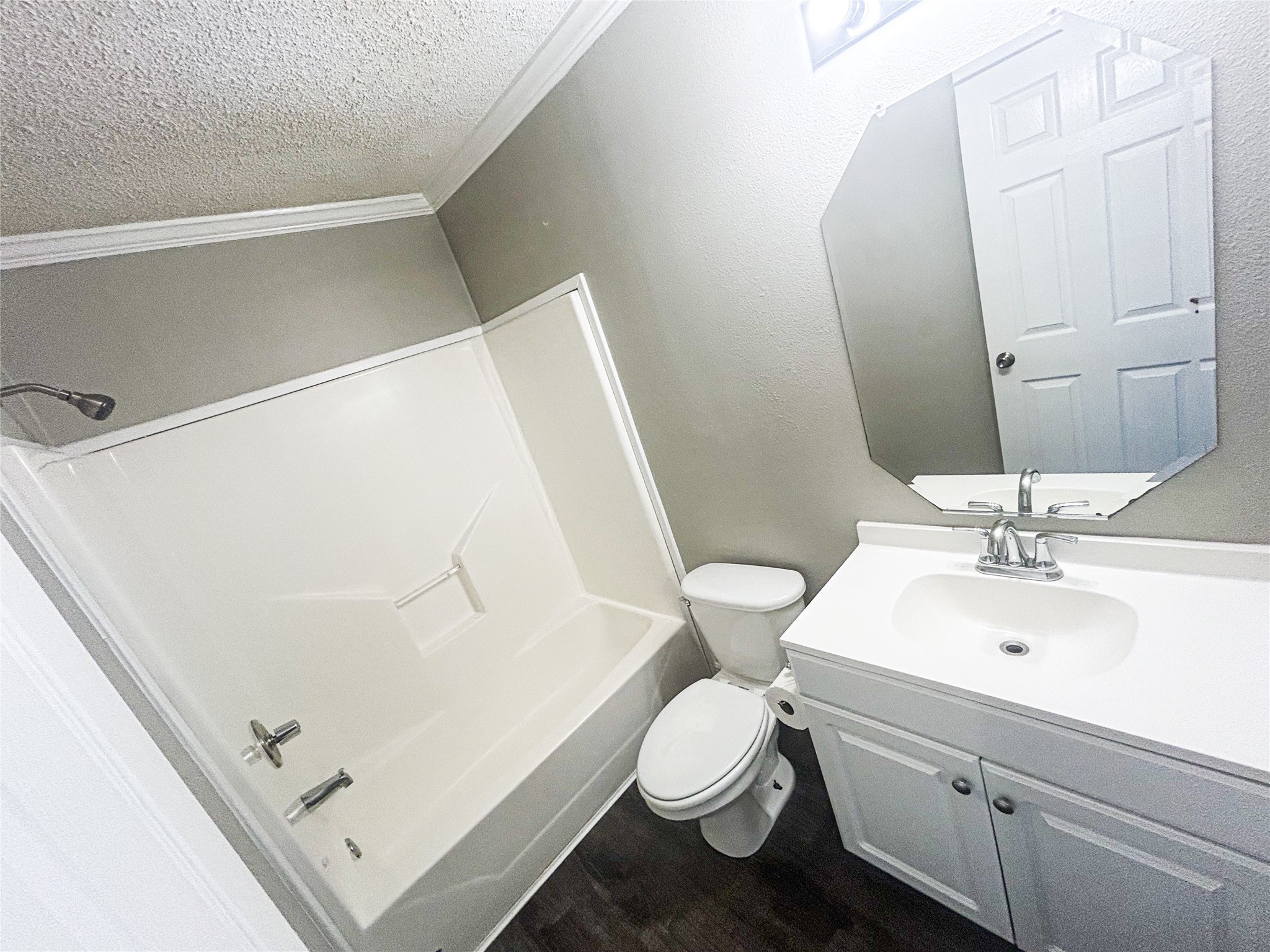 113 Varsity Circle Huntsville, TX 77340 - Photo 12 of 16 a bathroom with a sink a toilet and mirror