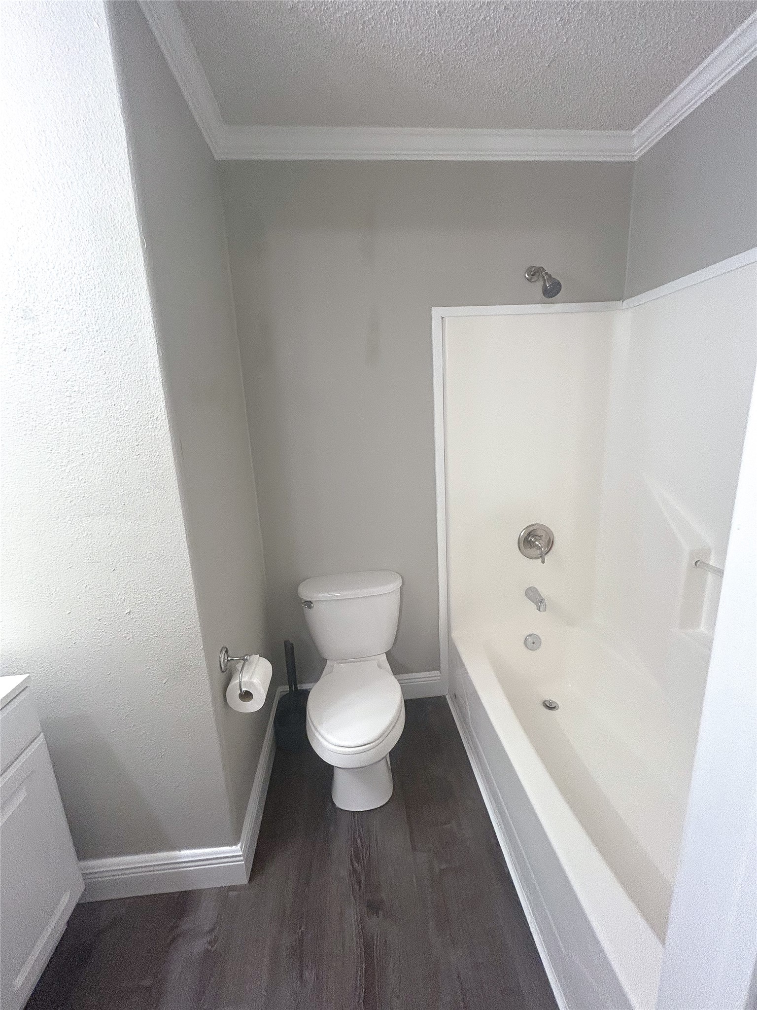 113 Varsity Circle Huntsville, TX 77340 - Photo 14 of 16 a white toilet sitting next to a bath tub