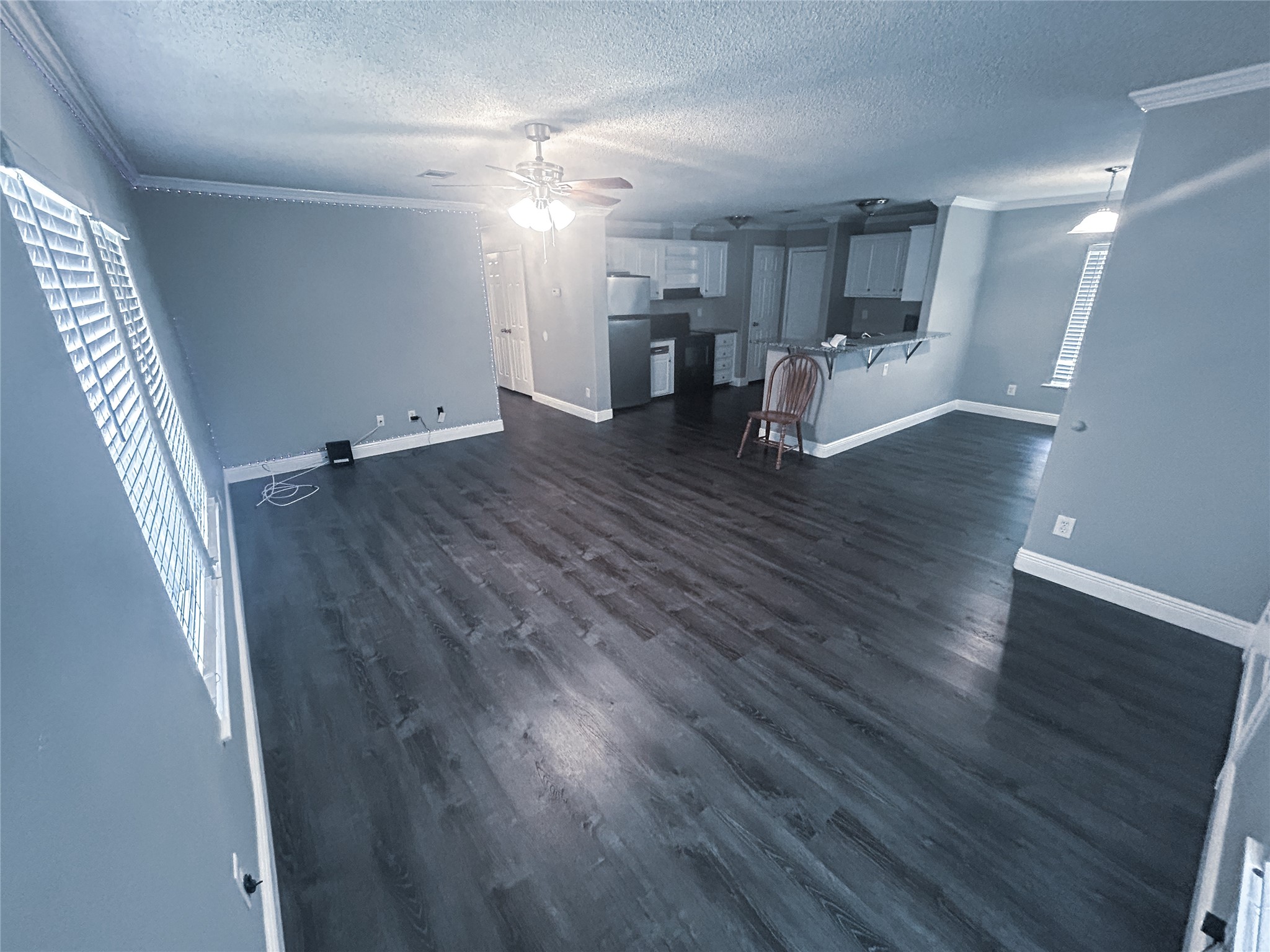 113 Varsity Circle Huntsville, TX 77340 - Photo 2 of 16 a view of empty room with wooden floor
