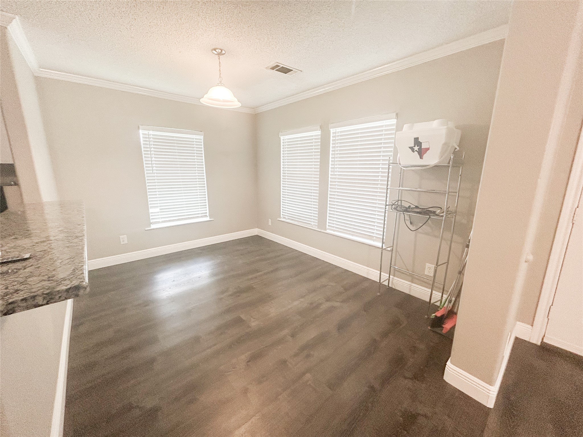 113 Varsity Circle Huntsville, TX 77340 - Photo 5 of 16 wooden floor in an empty room with a window