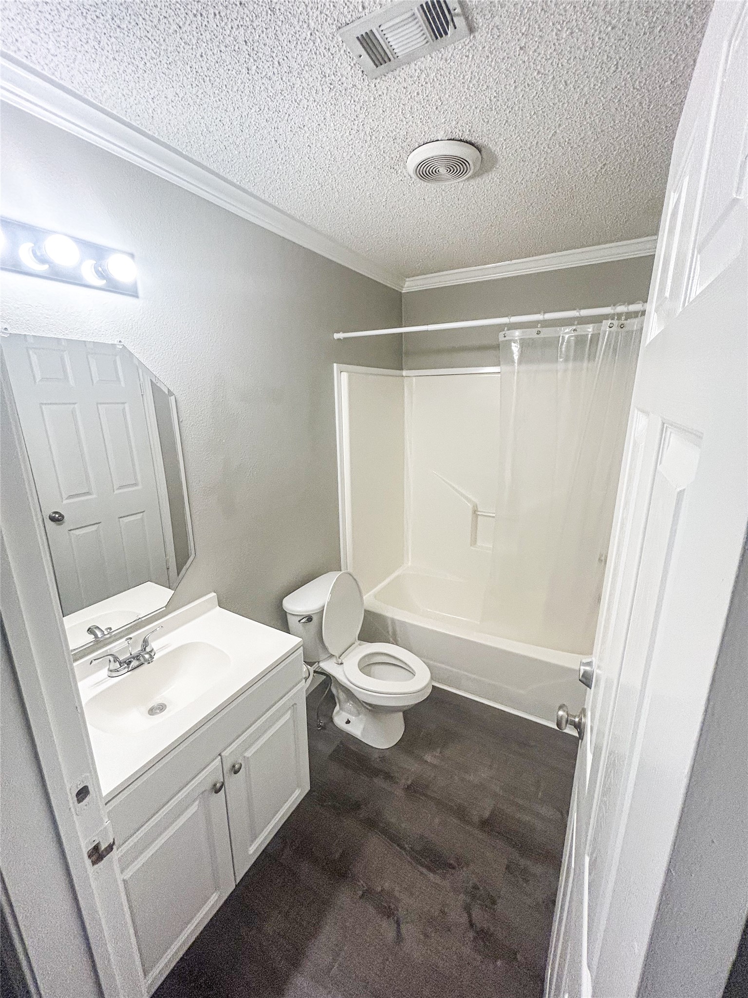 113 Varsity Circle Huntsville, TX 77340 - Photo 8 of 16 a bathroom with a sink a toilet and shower