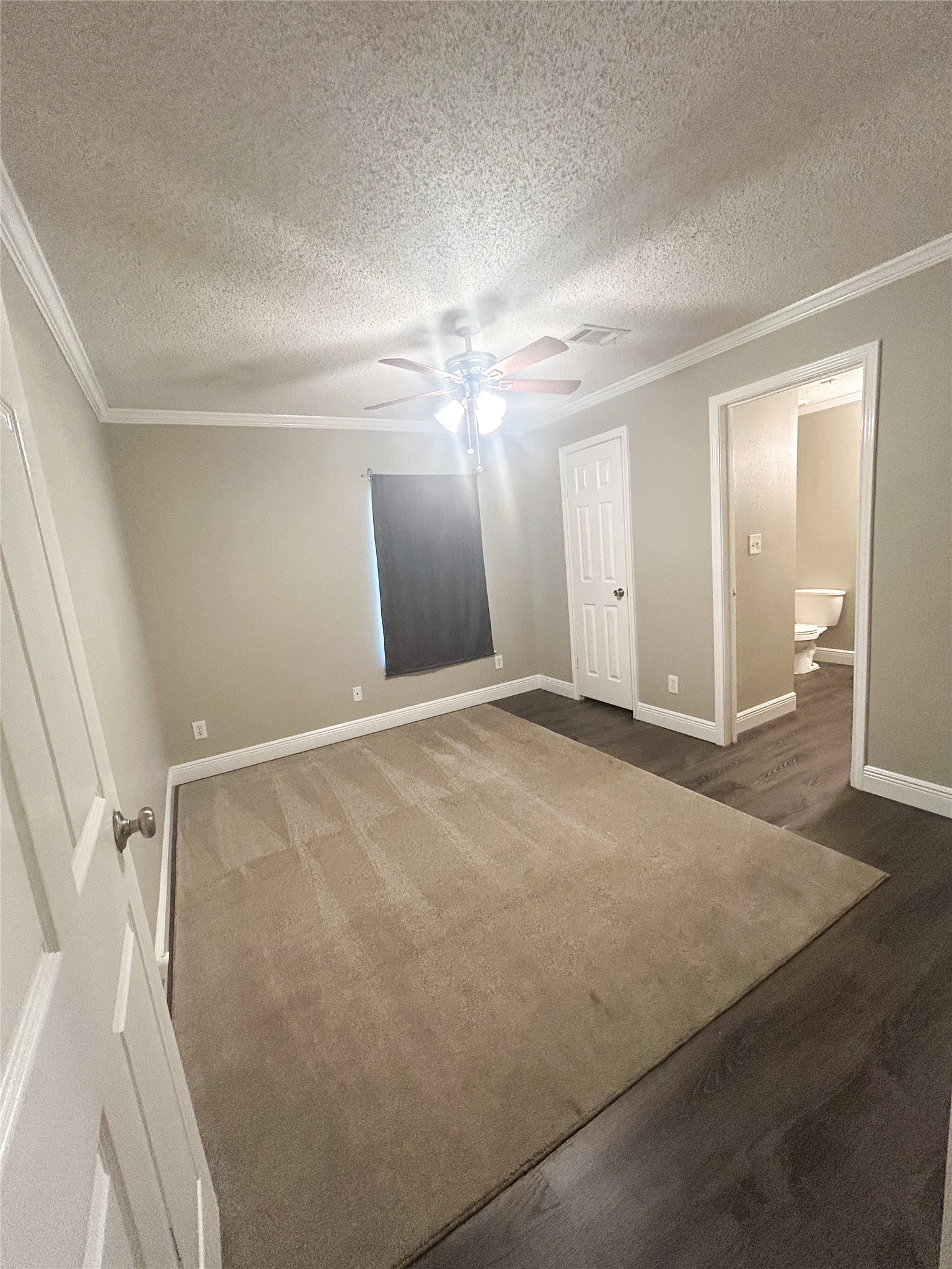 113 Varsity Circle Huntsville, TX 77340 - Photo 9 of 16 a view of a room with a ceiling fan