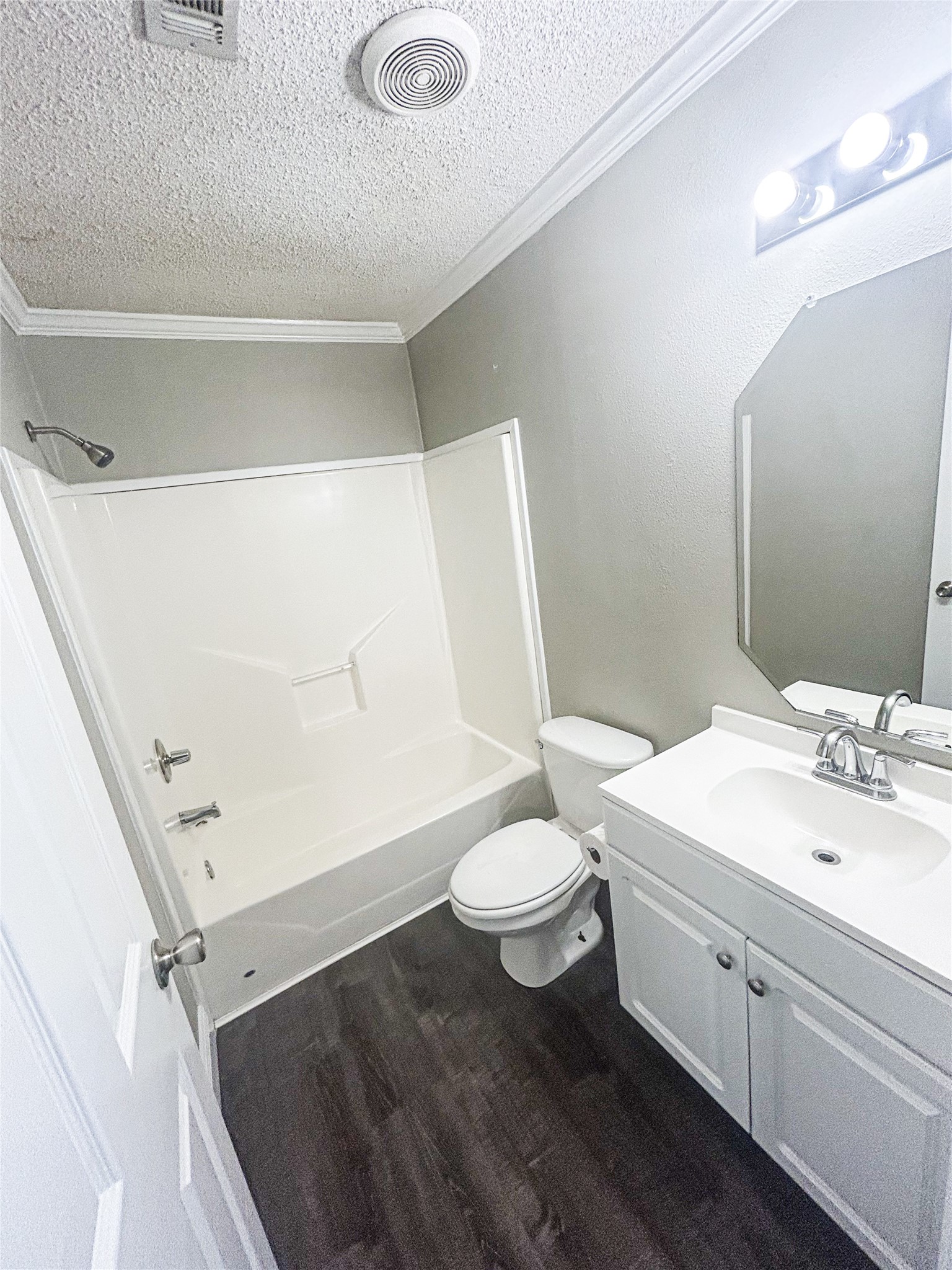 113 Varsity Circle Huntsville, TX 77340 - Photo 10 of 16 a bathroom with a sink a toilet and shower