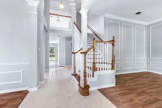 a view of entryway and hall with wooden floor