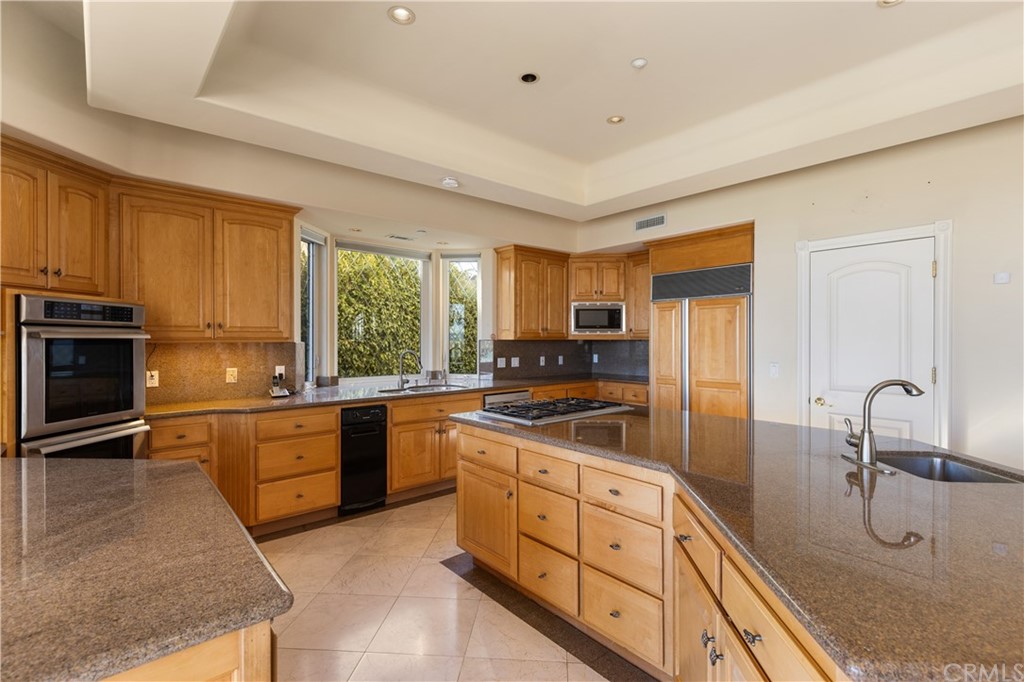 2 Crystal View Ridge Laguna Niguel, CA 92677 - Photo 13 of 50 a kitchen with stainless steel appliances granite countertop a stove sink and cabinets