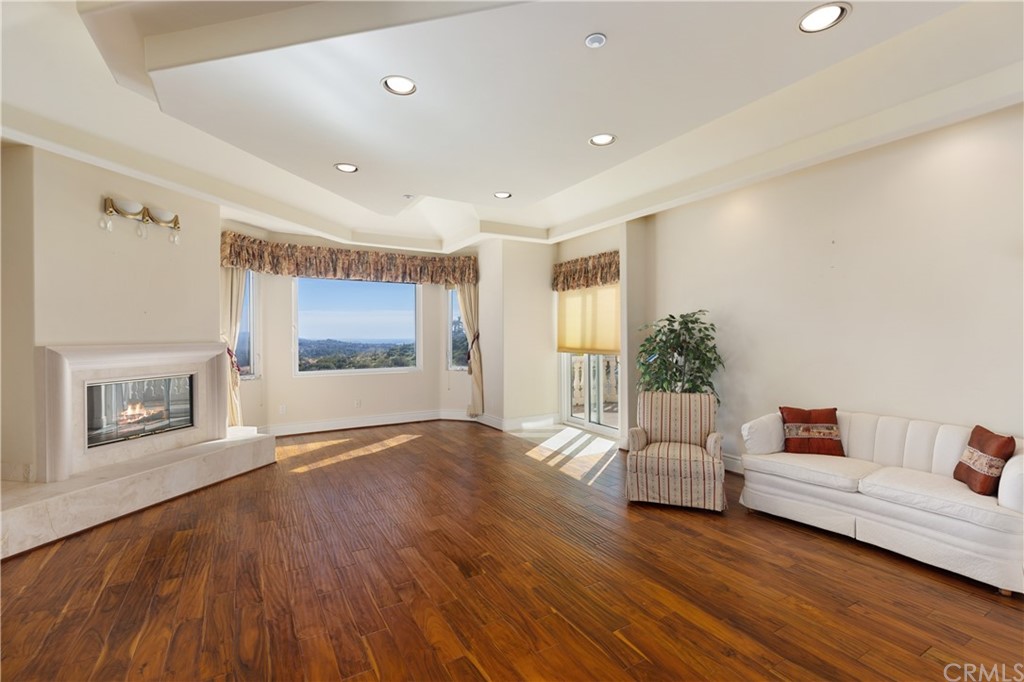 2 Crystal View Ridge Laguna Niguel, CA 92677 - Photo 27 of 50 a living room with furniture and a wooden floor