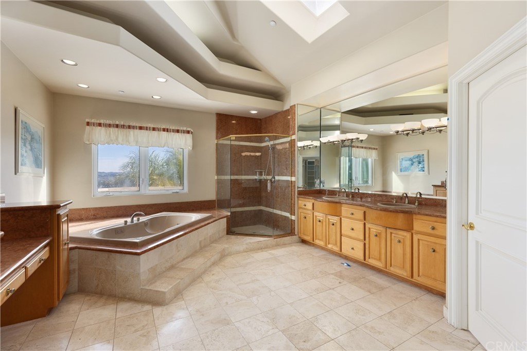 2 Crystal View Ridge Laguna Niguel, CA 92677 - Photo 28 of 50 a kitchen with granite countertop a stove sink and cabinets
