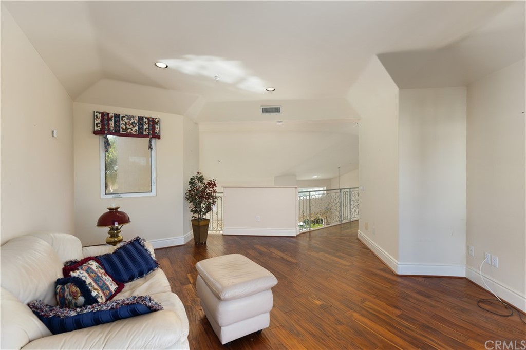 2 Crystal View Ridge Laguna Niguel, CA 92677 - Photo 33 of 50 a living room with furniture and wooden floor