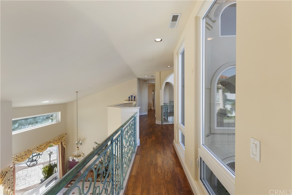 2 Crystal View Ridge Laguna Niguel, CA 92677 - Photo 34 of 50 a view of a hallway with wooden floor and staircase
