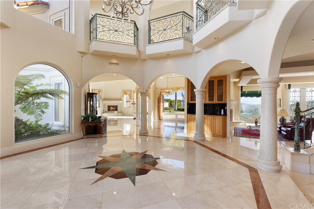 2 Crystal View Ridge Laguna Niguel, CA 92677 - Photo 8 of 50 a living room with fireplace furniture and a large window
