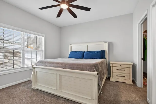 a bedroom with a large bed and a closet