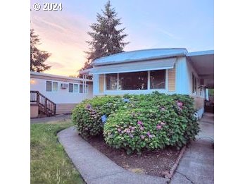 a view of a house with a garden
