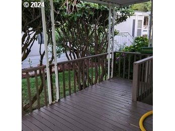 1125 58th Street, Unit 35 Springfield, OR 97478 - Photo 15 of 15 a view of balcony with wooden floor