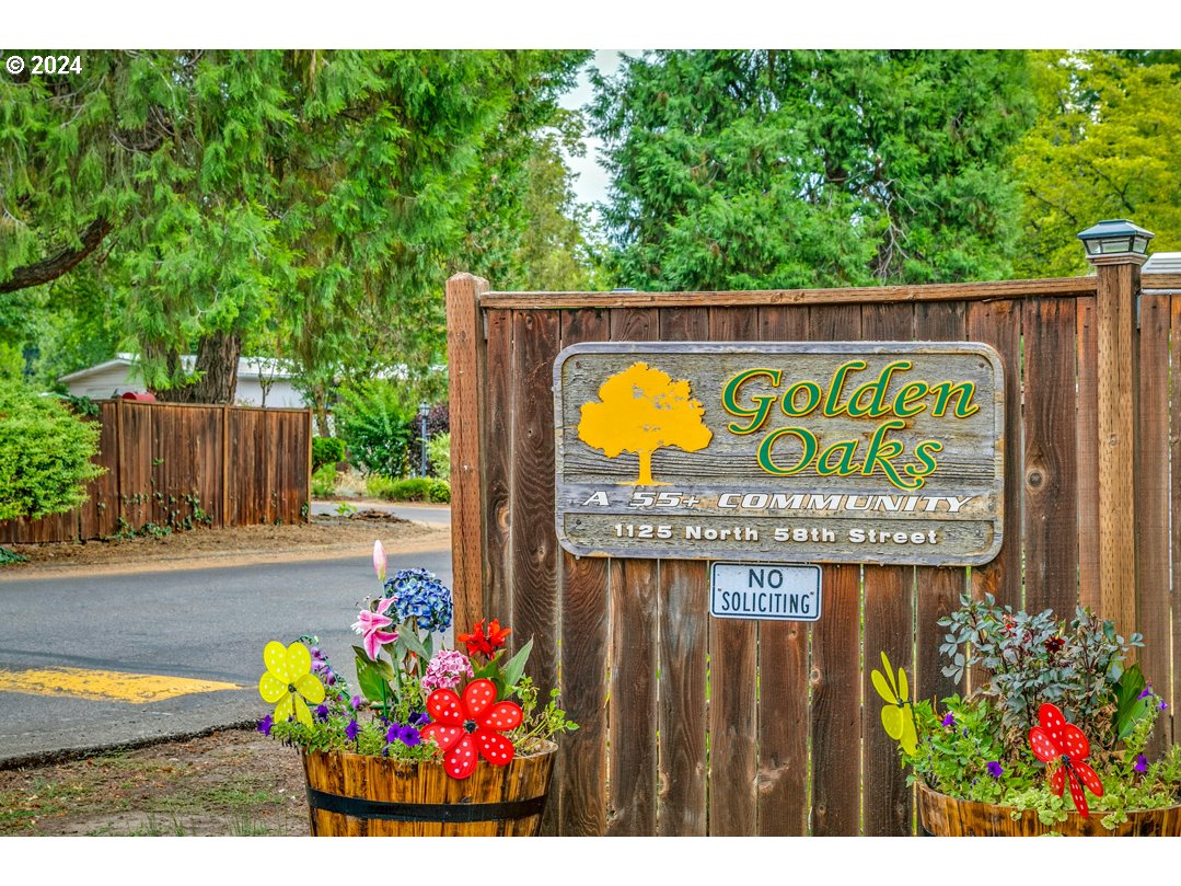 1125 58th Street, Unit 35 Springfield, OR 97478 - Photo 2 of 15 a sign on the side of the road