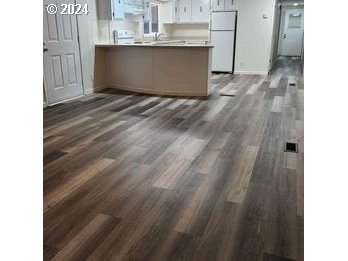 1125 58th Street, Unit 35 Springfield, OR 97478 - Photo 5 of 15 a view of a room with wooden floor