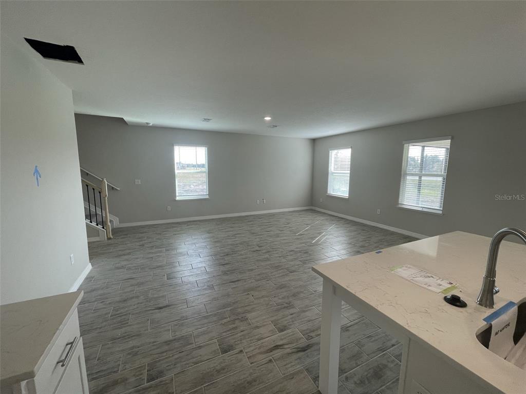 1701 Andover Rdg Drive DeLand, FL 32720 - Photo 5 of 14 a view of a livingroom with a staircase
