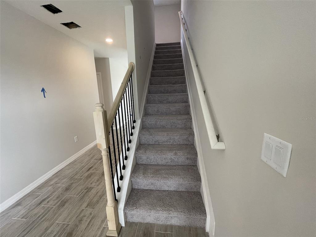 1701 Andover Rdg Drive DeLand, FL 32720 - Photo 7 of 14 a view of entryway and hall with wooden floor