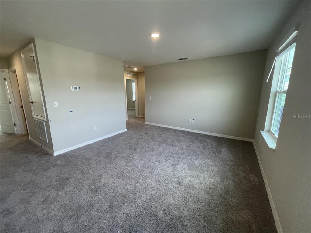 1701 Andover Rdg Drive DeLand, FL 32720 - Photo 8 of 14 an empty room with windows