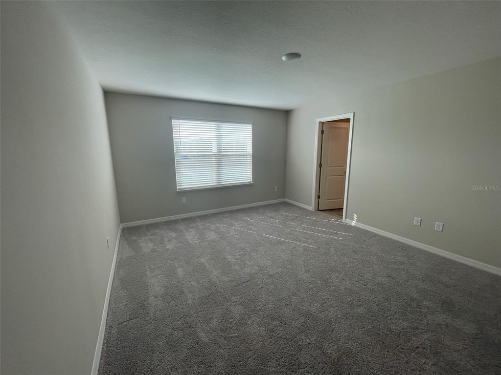 1701 Andover Rdg Drive DeLand, FL 32720 - Photo 9 of 14 an empty room with windows