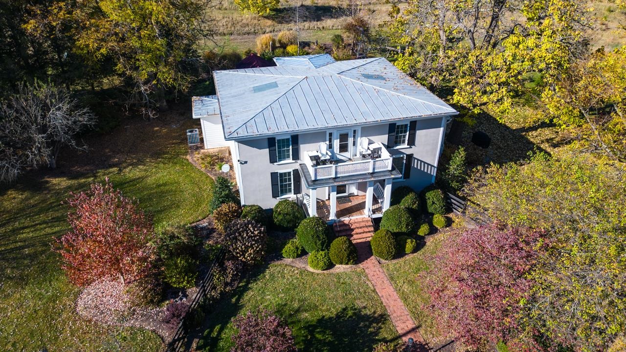 187 Todd Road Mount Sidney, VA 24467 - Photo 42 of 53 an aerial view of a house with table and chairs under an umbrella