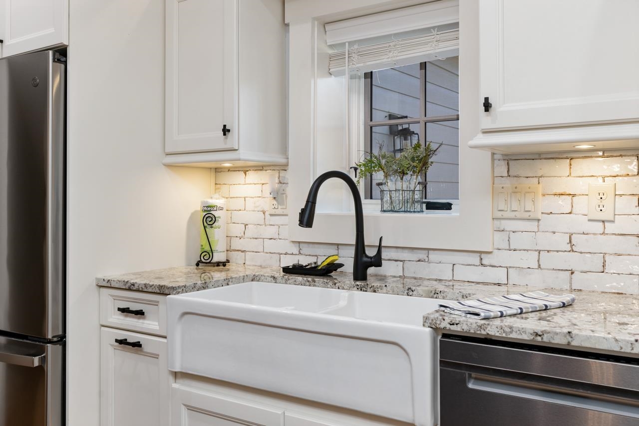 187 Todd Road Mount Sidney, VA 24467 - Photo 7 of 53 a kitchen with granite countertop a sink and cabinets