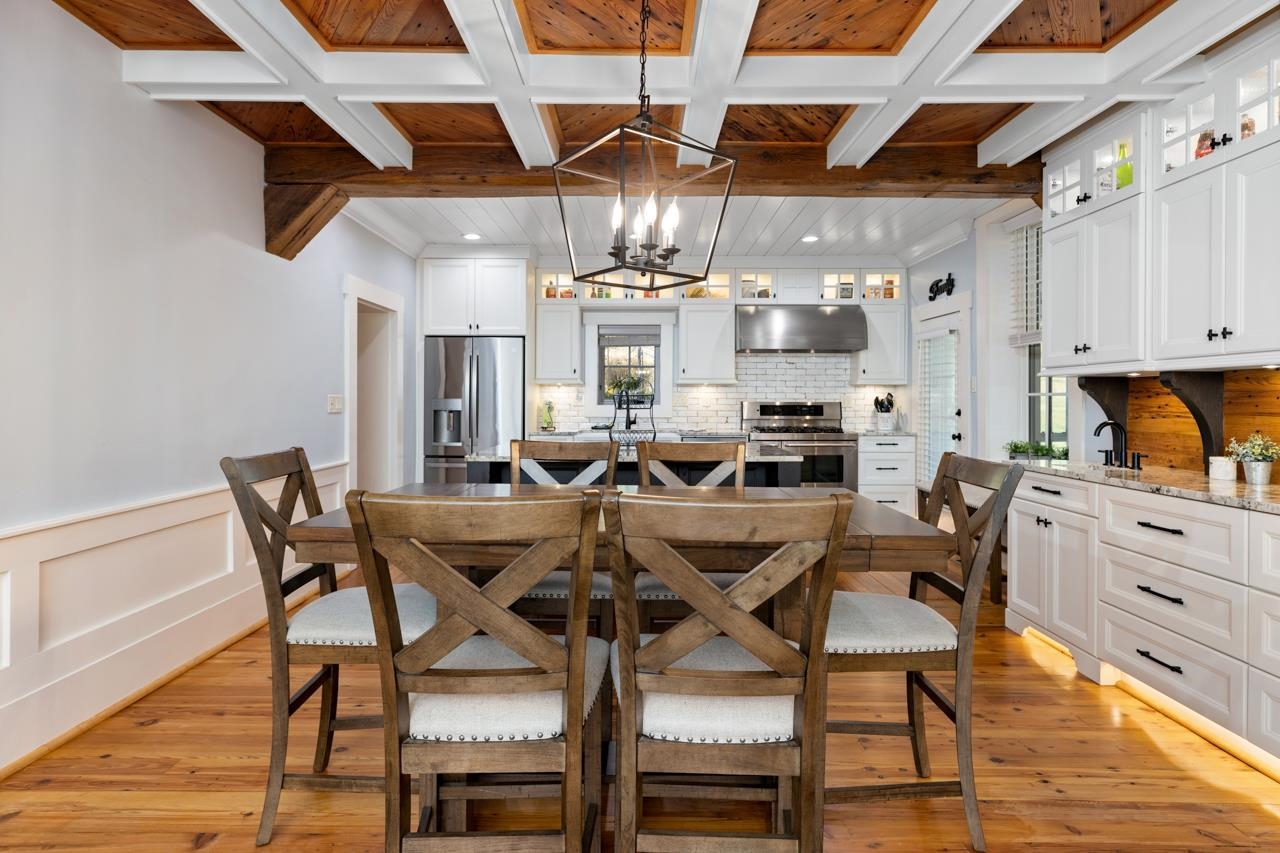 187 Todd Road Mount Sidney, VA 24467 - Photo 8 of 53 a view of a dining room with furniture a kitchen and chandelier