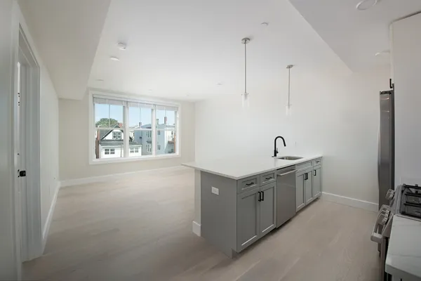 a spacious bathroom with a double vanity sink and a window