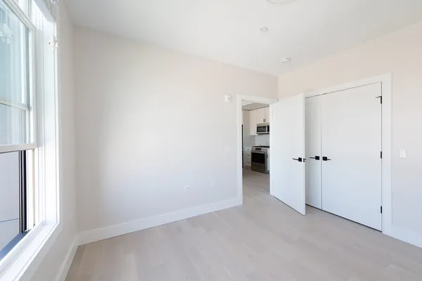 a view of an empty room with a window