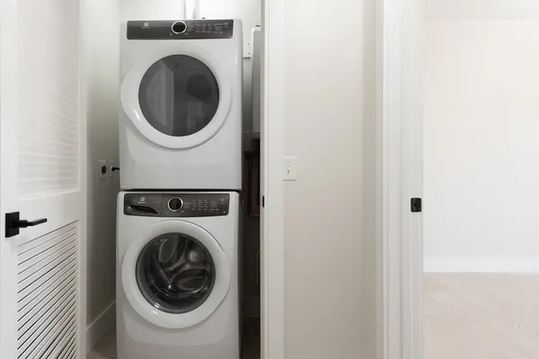 a utility room with dryer and washer