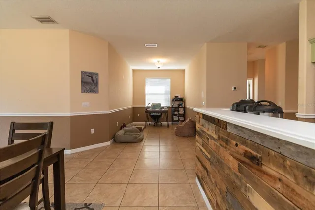 a large room with a couch and a view of living room