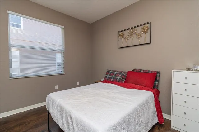 a bedroom with a bed and a dresser